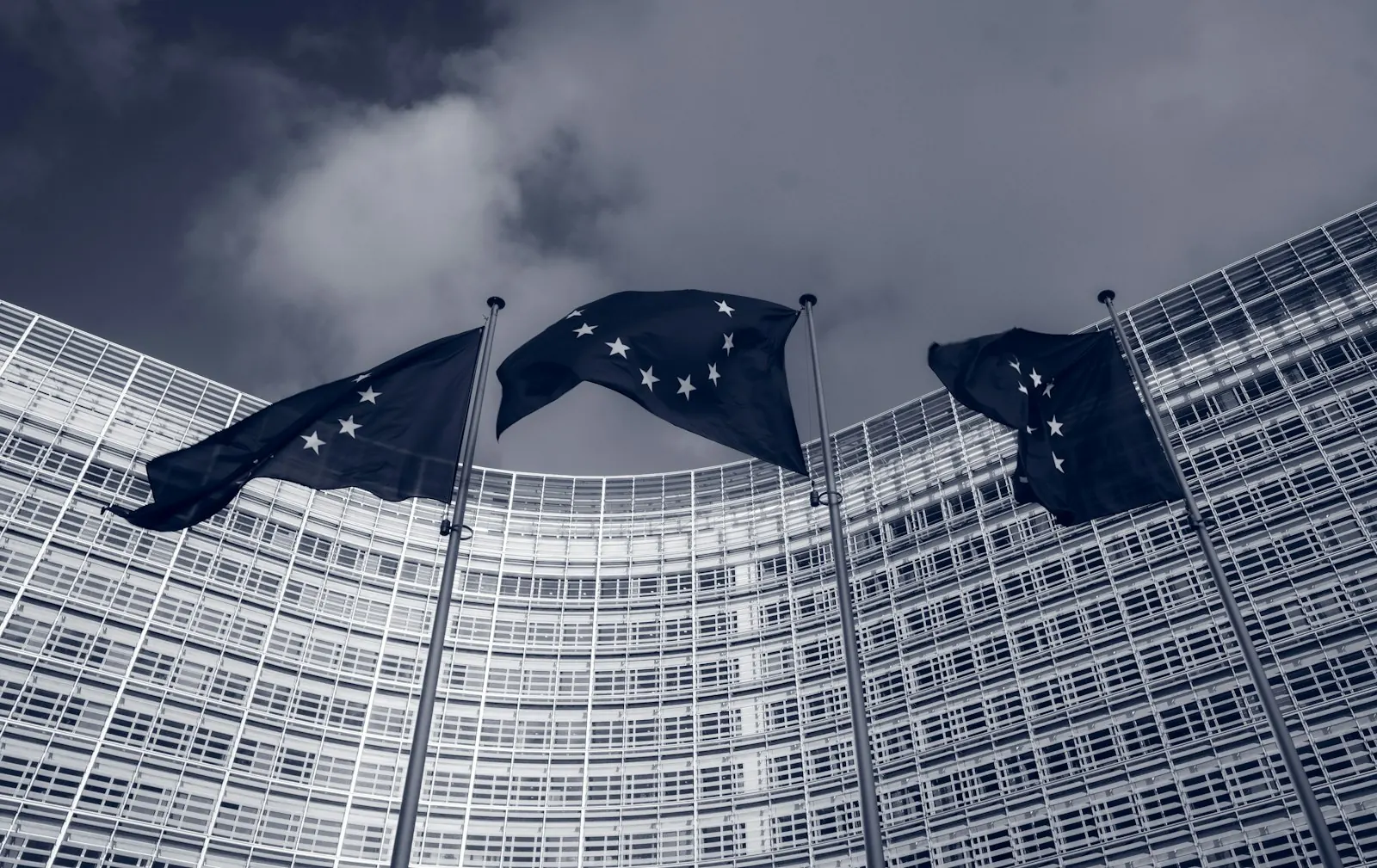 European Union flags flying in front of the Berlaymont building, headquarters of the European Commission in Brussels
