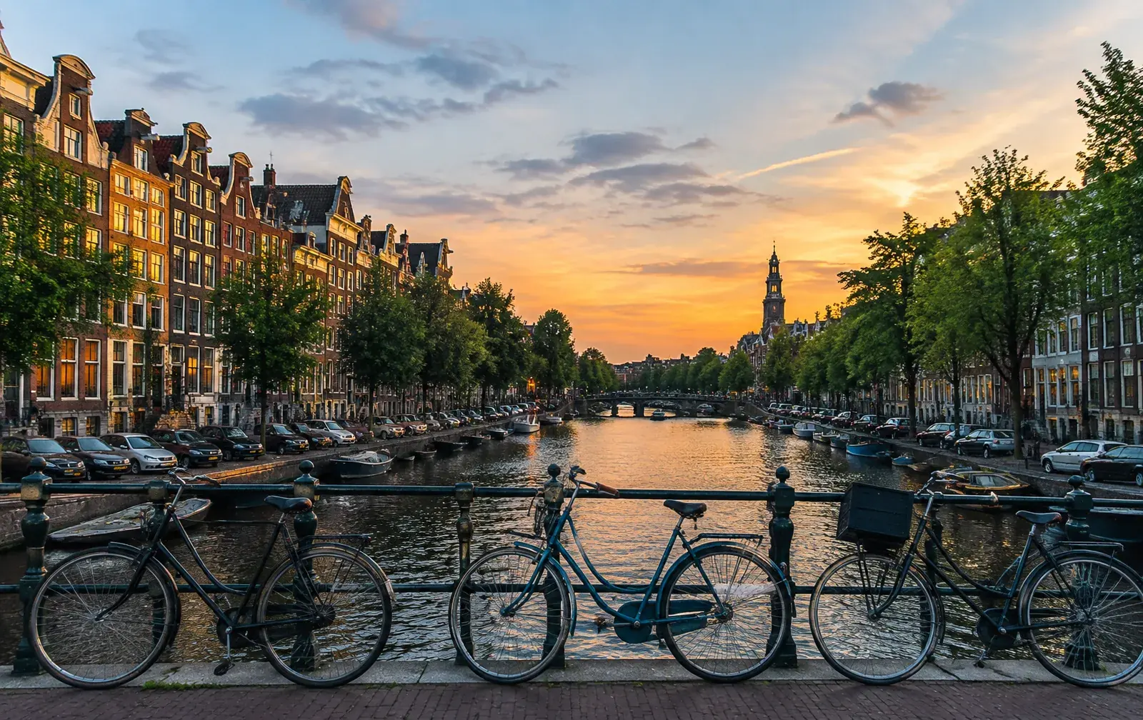 Amsterdam canal houses and bridges at dusk, illustrating the Netherlands as a destination for highly skilled international talent.