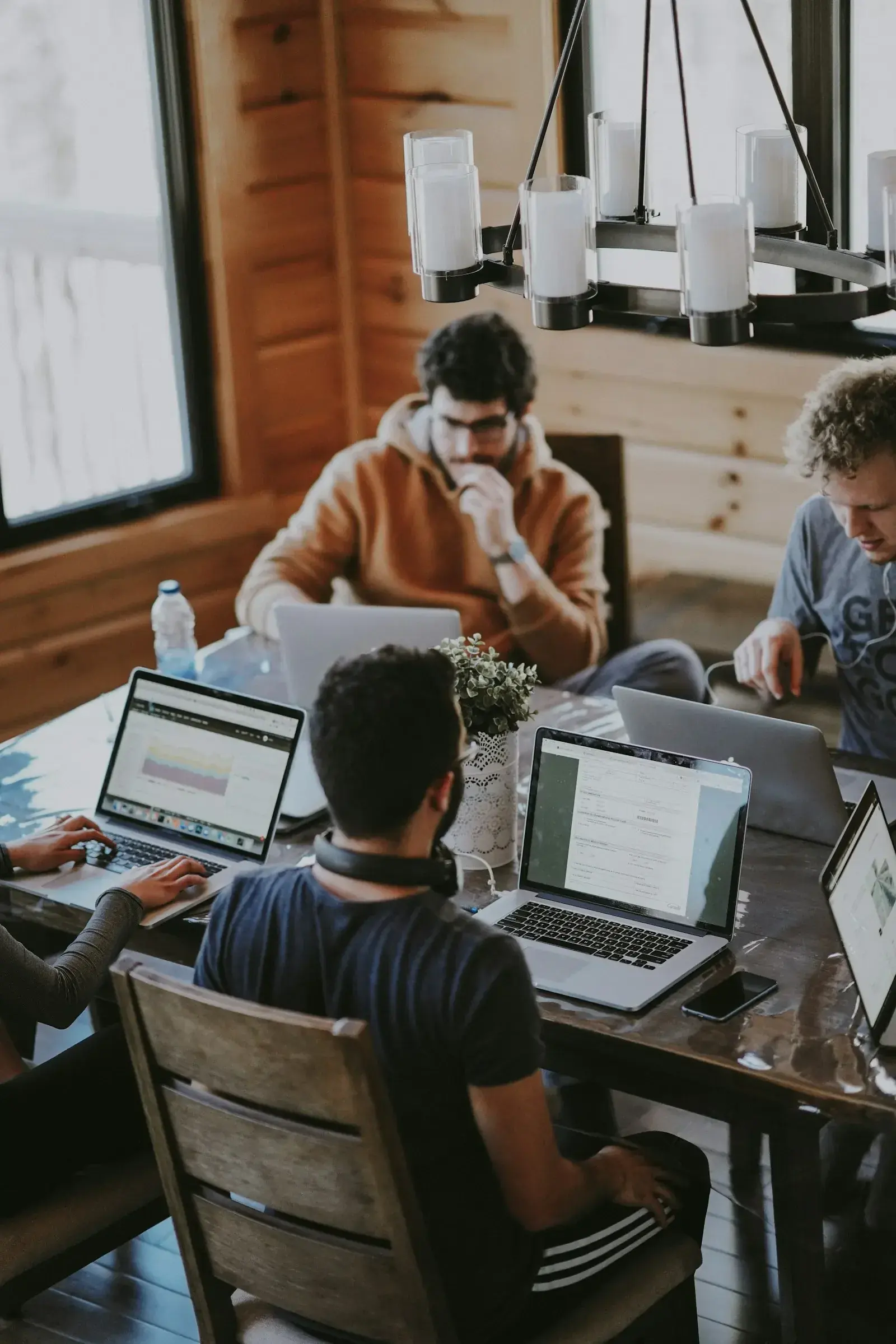Diverse team of professionals collaborating in a modern office, representing the shift of Employer of Record from a workaround to a core operating model in 2026.
