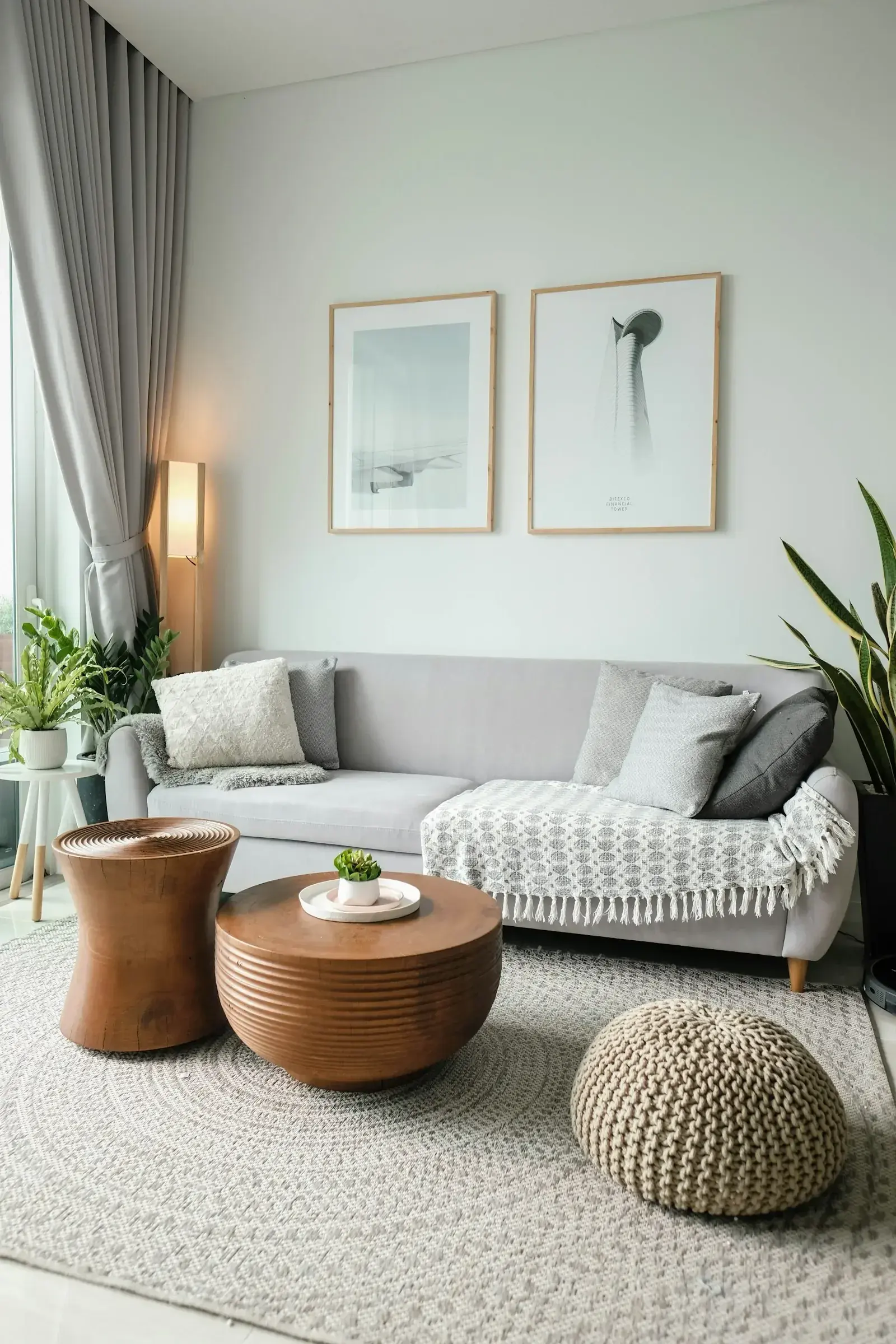 A person unpacking boxes in a new apartment, representing the settling-in stage of relocation that determines whether an assignee actually stays.