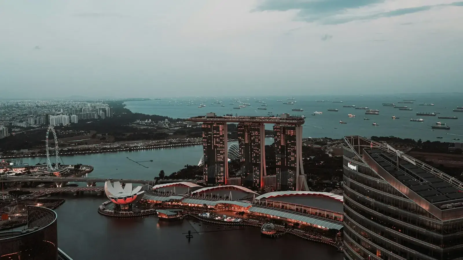 Singapore Marina Bay skyline at blue hour with office towers and harbour, representing Ministry of Manpower workforce rule changes