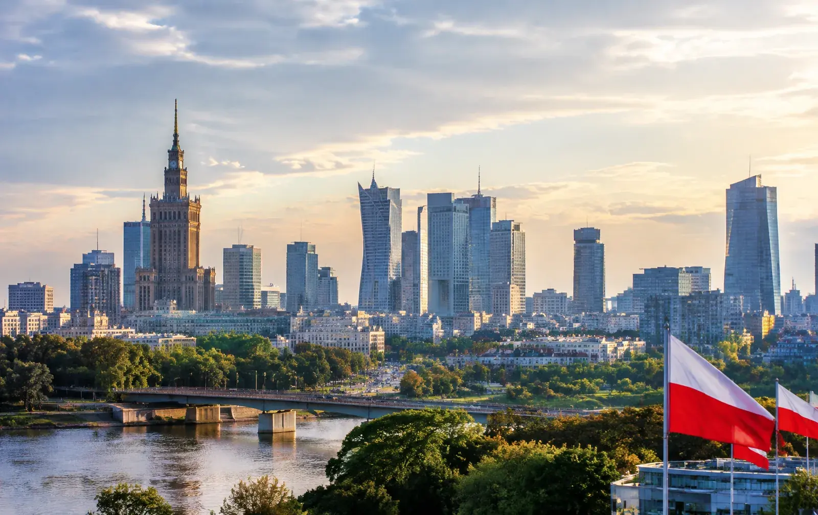 Warsaw skyline representing Poland's 2026 work permit reforms, MOS II online filing and tripled employer fines.